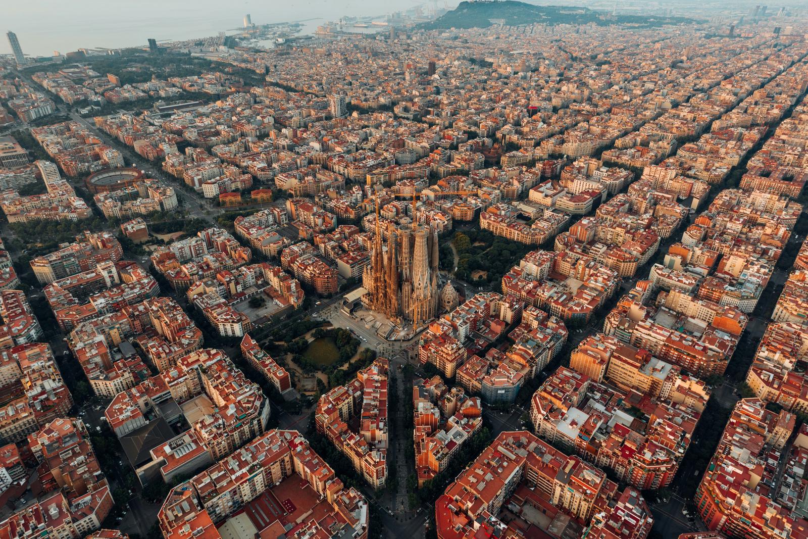 Aerial view of Barcelona's Eixample grid with the Sagrada Familia at its centre