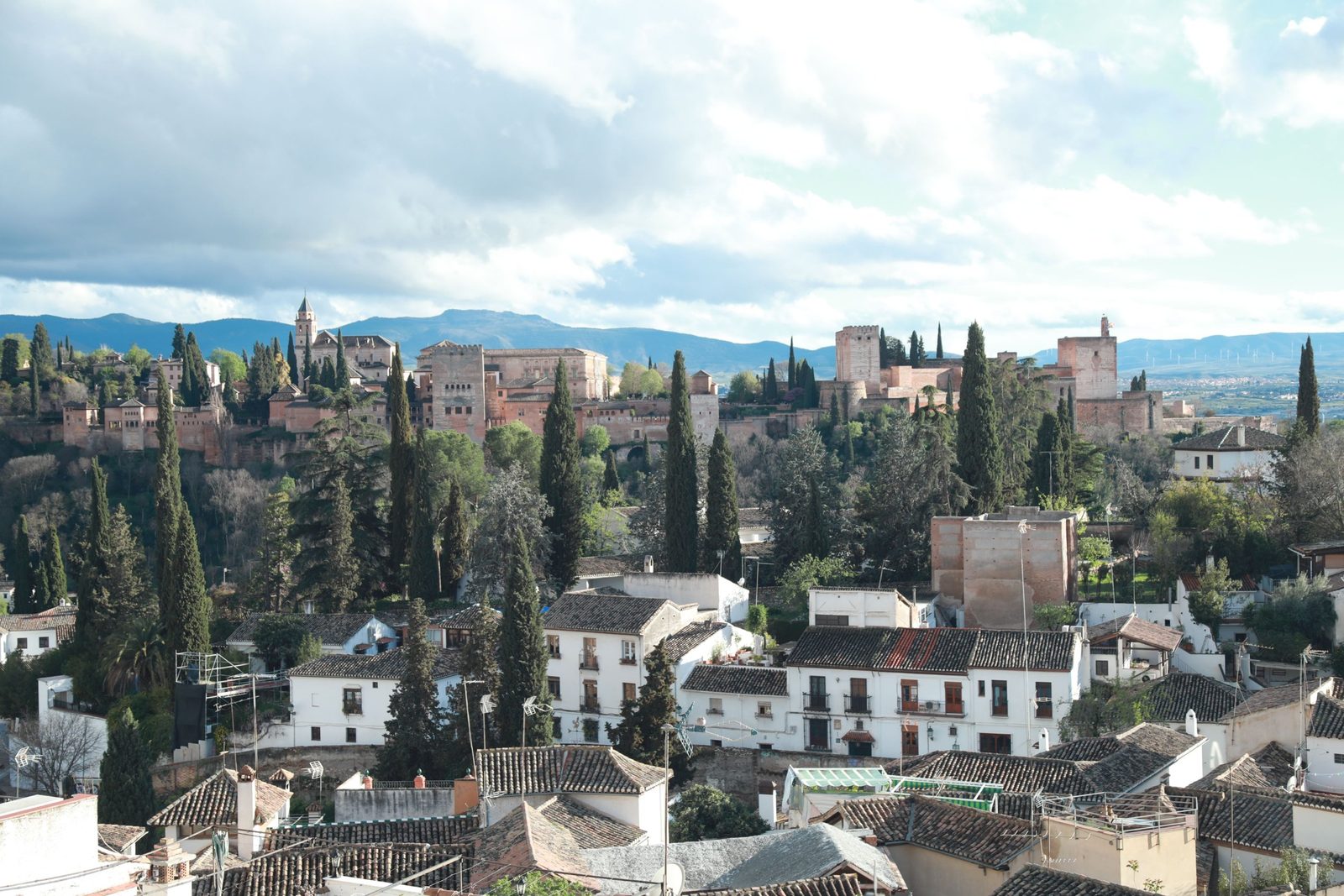 The Alhambra above the white houses of the Albaicín in Granada