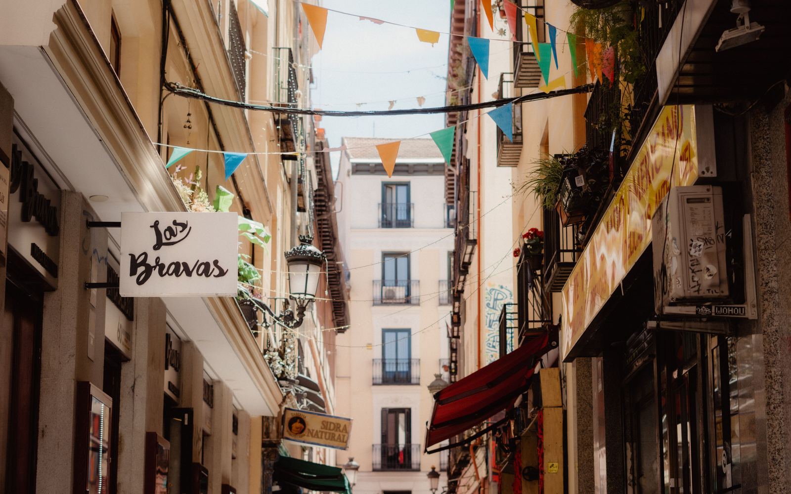The narrow street outside Las Bravas in central Madrid
