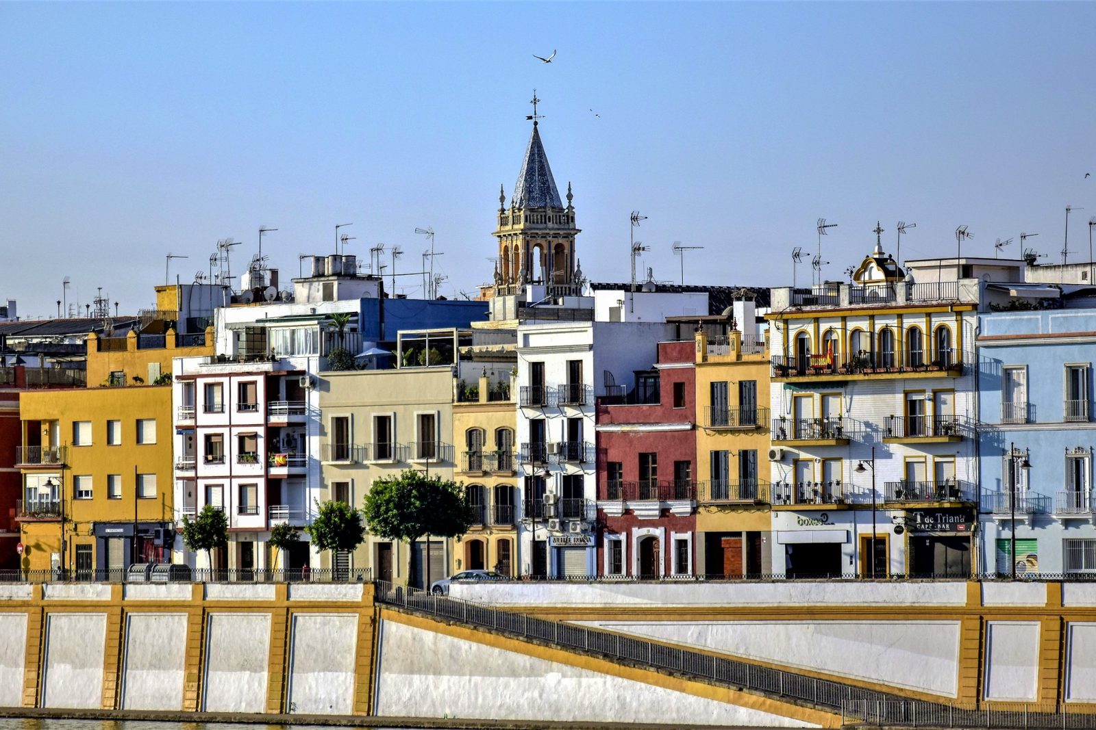 Colorful houses along the Triana riverfront in Seville